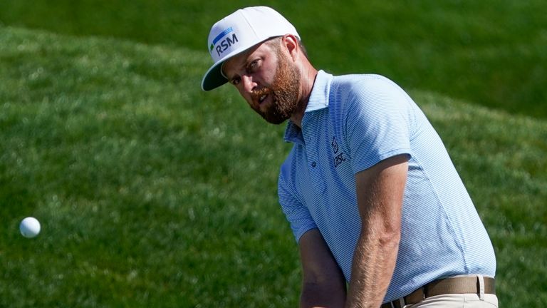 Chris Kirk chips to the green on the ninth hole during the second round of the The Players Championship golf tournament Friday, March 12, 2021, in Ponte Vedra Beach,