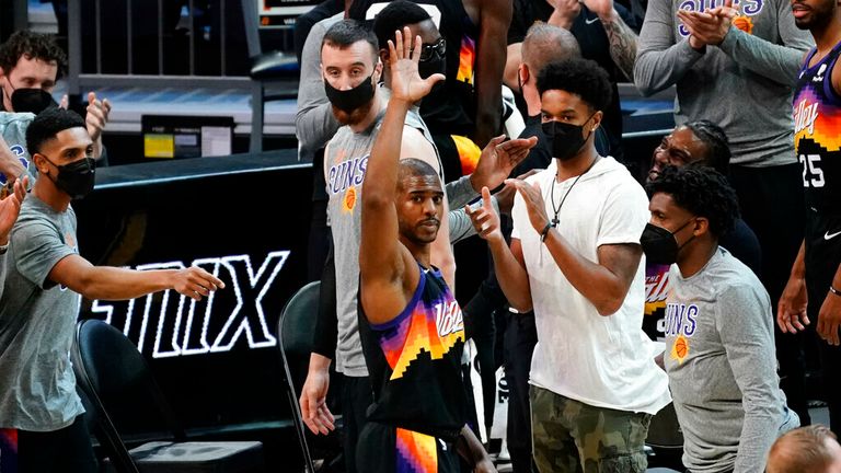AP - Phoenix Suns guard Chris Paul acknowledges the fans after recording his 10,000th career assist