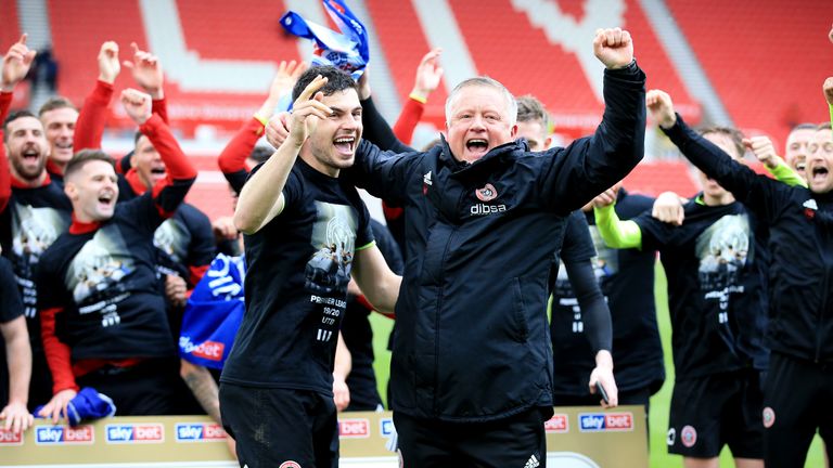 Chris Wilder and John Egan celebrate promotion to the Premier League at Stoke City on the final day of the 2018/19 Championship seasom