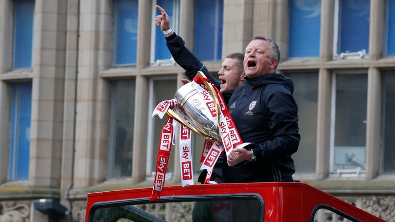 Chris Wilder with the League One trophy during an open top bus parade in 2017