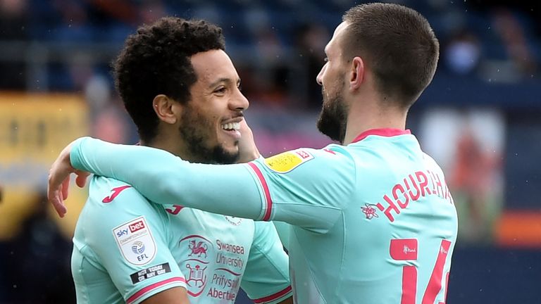 Swansea City's Conor Hourihane (right) celebrates scoring against Luton