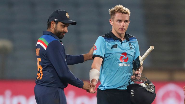 Rohit Sharma commiserates with England's Sam Curran after India triumphed by seven runs to seal the ODI series 2-1 in Pune