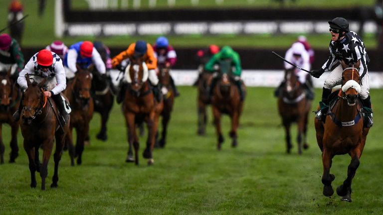 David Bass on Imperial Aura celebrates as he crosses the line to win the Northern Trust Company Novices Handicap Chase