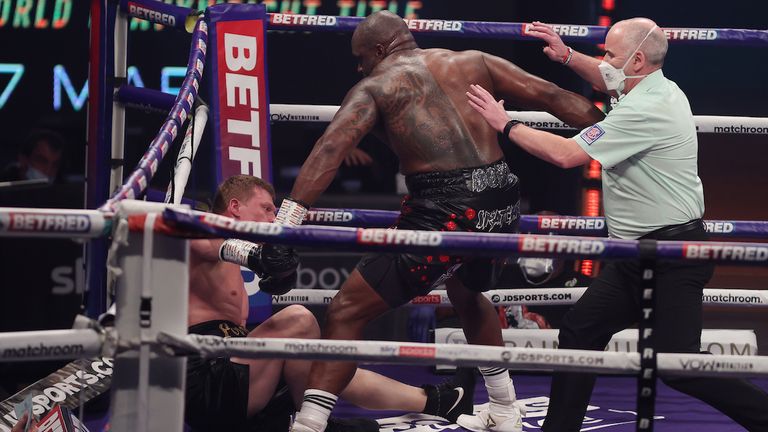 *** FREE FOR EDITORIAL USE ***.Alexander Povetkin v Dillian Whyte,  Interim WBC Heavyweight World Title..27 March 2021.Picture By Mark Robinson Matchroom Boxing.Dillian Whyte knocks down Alexander Povetkin. 