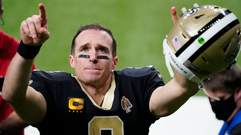 New Orleans Saints quarterback Drew Brees gestures to his family and fans after an NFL divisional round playoff football game against the Tampa Bay Buccaneers, Sunday, Jan. 17, 2021, in New Orleans. The Buccaneers won 30-20. (AP Photo/Brynn Anderson)       