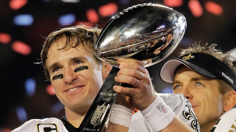 New Orleans Saints quarterback Drew Brees (9) celebrates with the Vince Lombardi Trophy after the Saints' 31-17 win over the Indianapolis Colts in the NFL Super Bowl XLIV football game in Miami, Sunday, Feb. 7, 2010. (AP Photo/Julie Jacobson)