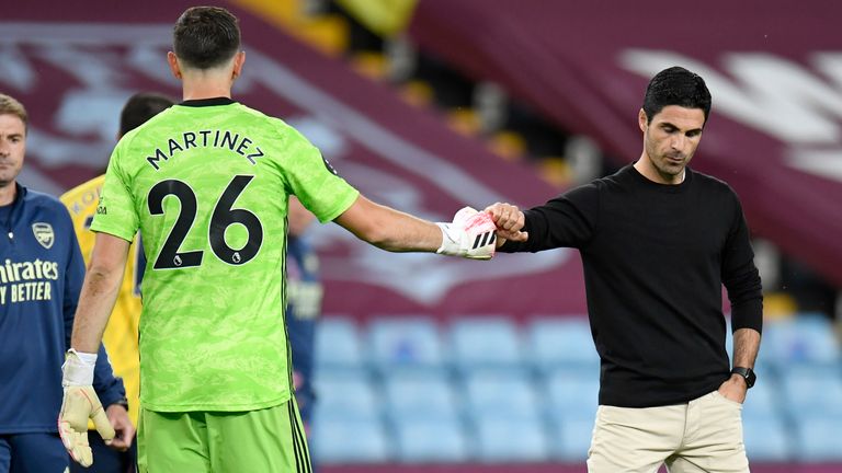 Arsenal...s head coach Mikel Arteta gestures with his goalkeeper Emiliano Martinez after the English Premier League soccer match between Aston Villa and Arsenal at Villa Park in Birmingham, England, Tuesday, July 21, 2020. (AP Photo/Peter Powell,Pool).