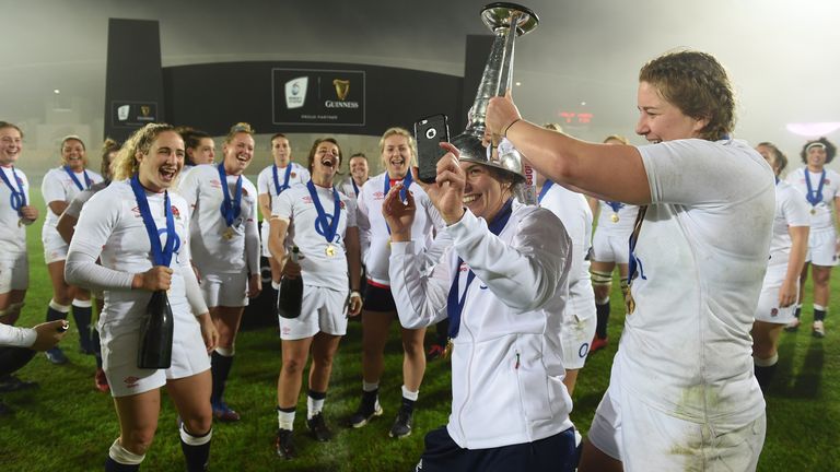 Sarah Hunter of England celebrates with the 6 Nations trophy after winning the Grand Slam during the Women's Six Nations match between Italy and England on November 01, 2020 in Parma, Italy. Football Stadiums around Europe remain empty due to the Coronavirus Pandemic as Government social distancing laws prohibit fans inside venues resulting in fixtures being played behind closed doors (Photo by Chris Ricco - RFU / The RFU Collection via Getty Images).