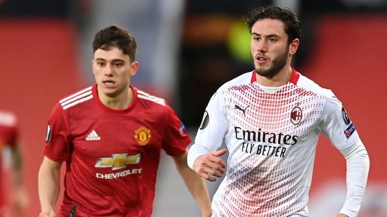 Davide Calabria battles for possession with Daniel James