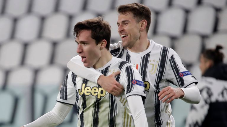 Juventus' Federico Chiesa celebrates with Aaron Ramsey after scoring against Porto