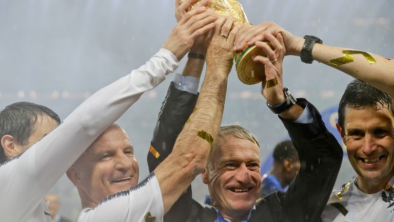 France head coach Didier Deschamps and his team hold aloft the World Cup