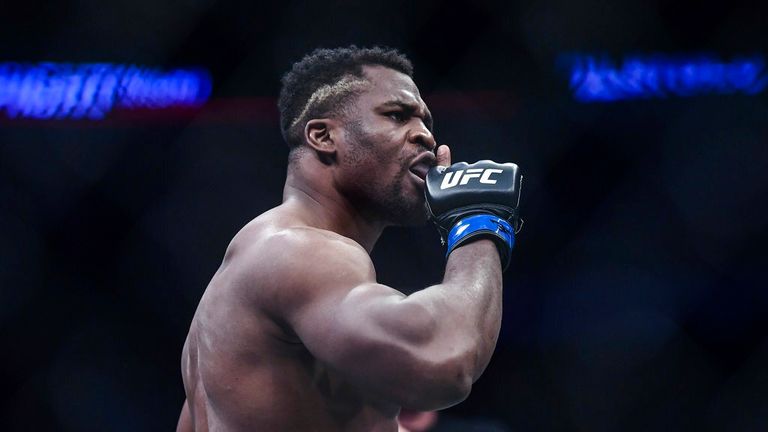 AP - Francis Ngannou of Cameroon and France (blue gloves) reacts against Curtis Blaydes of America (red gloves) during the UFC Fight Night
