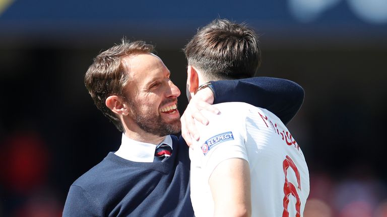 AP - Harry Maguire with Gareth Southgate