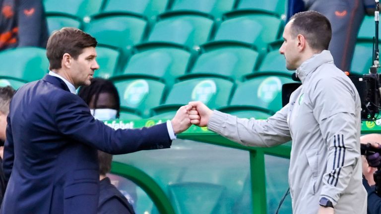 Rangers manager Steven Gerrard (L) and Celtic interim manager John Kennedy shake hands at full time