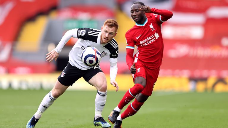 Harrison Reed and Naby Keita battle for possession at Anfield