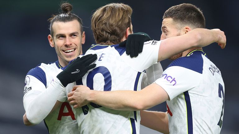 Harry Kane celebrates with Gareth Bale and Matt Doherty after scoring Spurs' third goal (AP)