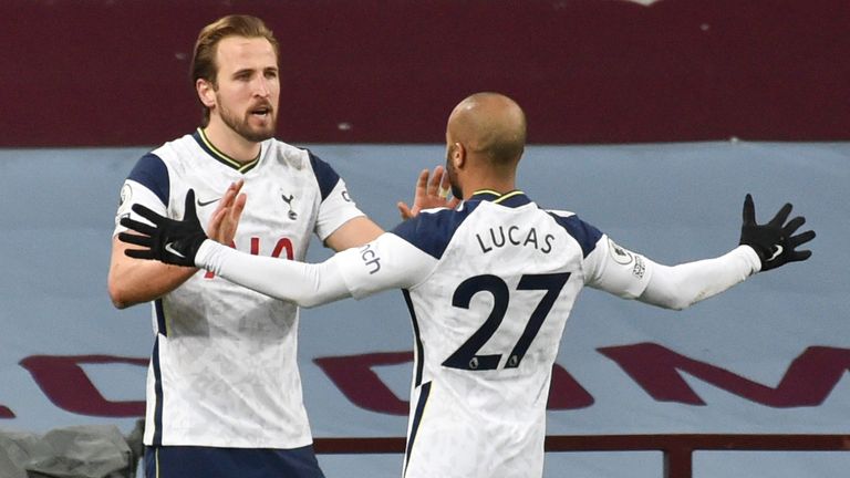 Tottenham's Harry Kane, left, is congratulated by teammate Lucas Moura after scoring his team's second goal during the English Premier League soccer match between Aston Villa and Tottenham Hotspur at Villa Park in Birmingham, England, Sunday, March 21, 2021. (AP Photo/Rui Vieira,Pool)