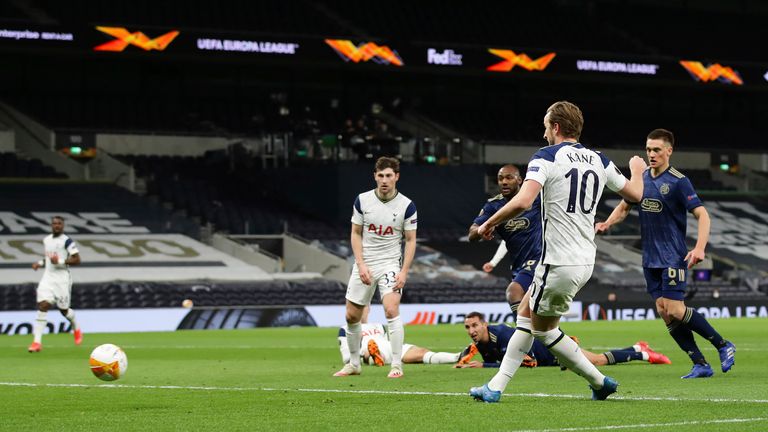 The Tottenham striker keeps his composure to steer home the opener