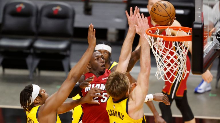 Miami Heat guard Kendrick Nunn goes past Indiana Pacers center Myles Turner and Indiana Pacers forward Domantas Sabonis