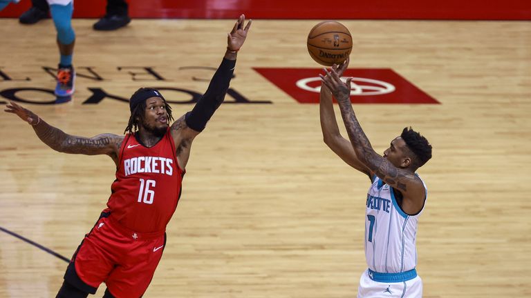 Charlotte Hornets guard Malik Monk shoots the ball as Houston Rockets guard Ben McLemore defends