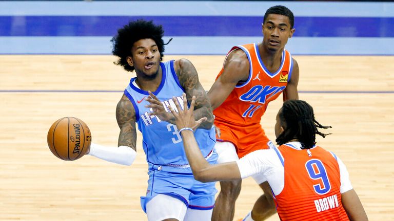 AP - Houston Rockets guard Kevin Porter Jr. (3) passes the ball under pressure from Oklahoma City Thunder guard Theo Maledon (11)