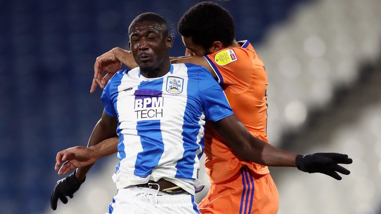 Huddersfield Town v Cardiff City - Sky Bet Championship - John Smith&#39;s Stadium
Huddersfield Town&#39;s Yaya Sanogo (left) and Cardiff City&#39;s Curtis Nelson battle for the ball during the Sky Bet Championship match at the John Smith&#39;s Stadium, Huddersfield. Picture date: Friday March 5, 2021.