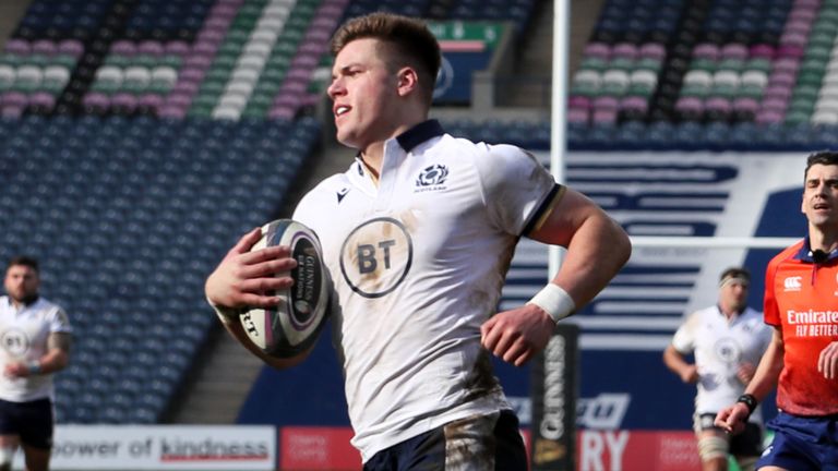 Scotland's Huw Jones runs through to score their fourth try during the Guinness Six Nations match against Italy