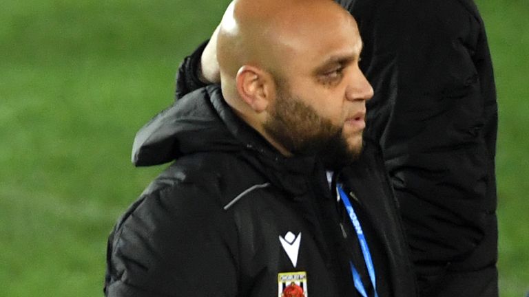 Chorley head of coaching and youth development Irfan Kawri  celebrates after FA Cup second round match at the Weston Homes Stadium, Peterborough.