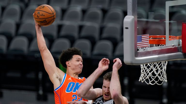 Oklahoma City Thunder center Isaiah Roby scores over San Antonio Spurs center Jakob Poeltl