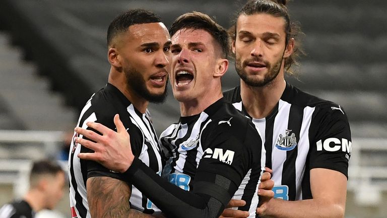 Jamaal Lascelles is congratulated after rescuing a point for Newcastle with a 94th-minute equaliser