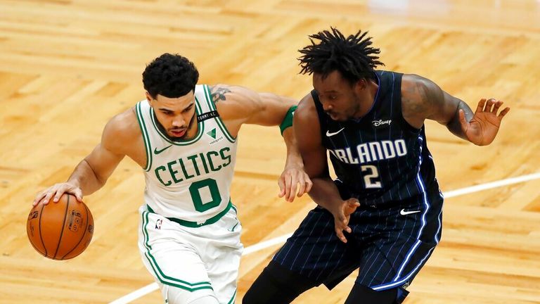 AP - Boston Celtics&#39; Jayson Tatum (0) drives past Orlando Magic&#39;s Al-Farouq Aminu (2)