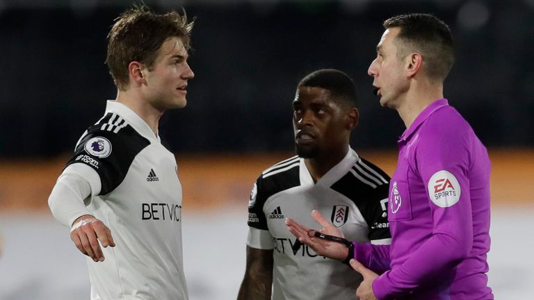 Fulham captain Joachim Andersen talks to referee David Coote after their equaliser was disallowed for handball