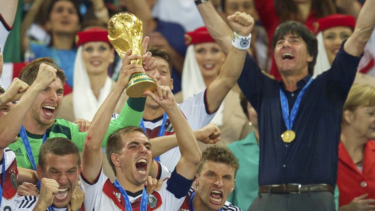 (L-R) Lukas Podolski of Germany, Philipp Lahm of Germany, Thomas Muller of Germany, coach Joachim Low of Germany with world cup trophy during the final of the FIFA World Cup 2014 on July 13, 2014 at the Maracana stadium in Rio de Janeiro, Brazil.(