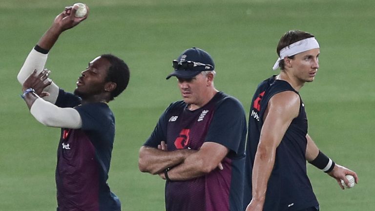 Associated Press: England head coach Chris Silverwood watches Jofra Archer bowl at the nets as Tom Curran, right, walks past