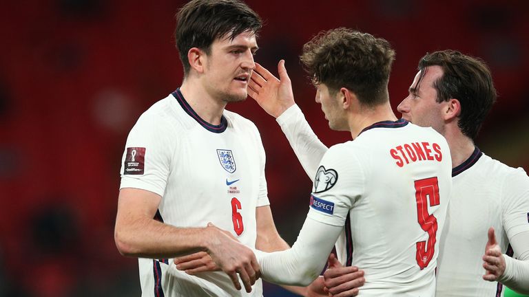 John Stones embraces with Harry Maguire after the victory