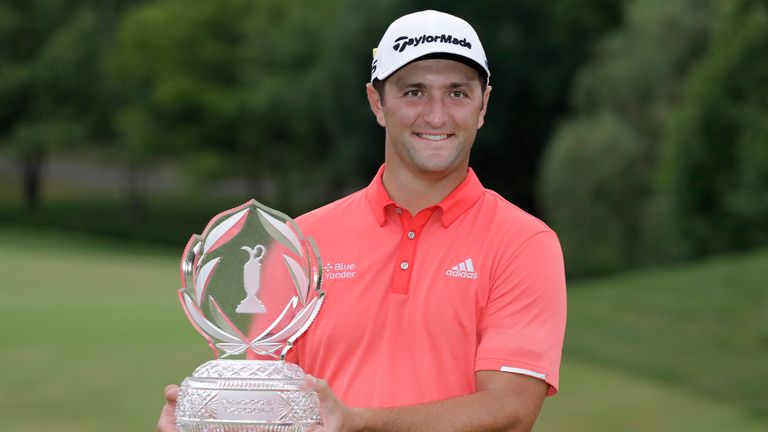 Jon Rahm, of Spain, poses with the trophy after winning the Memorial golf tournament