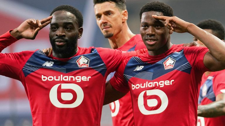Jonathan David (right) scored late on to hand Lille victory                               