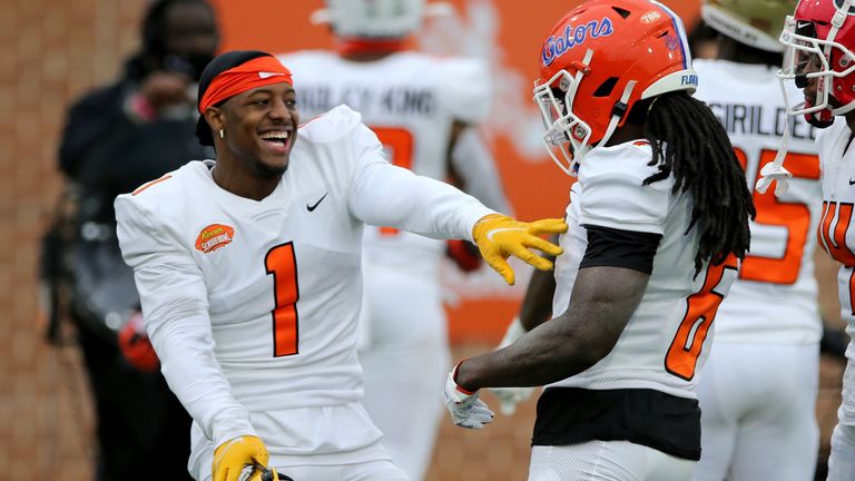 Bledsoe (1) celebrates a play with Florida defensive back Shawn Davis during the Senior Bowl. (AP Photo/Rusty Costanza)