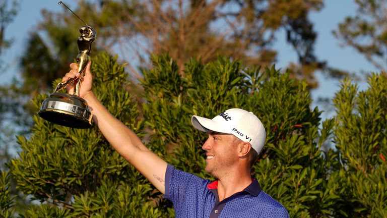 Justin Thomas holds the trophy after winning The Players Championship golf tournament 