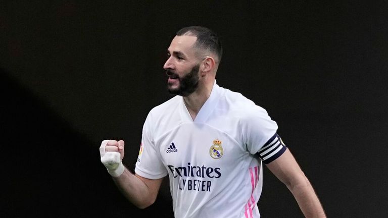 Karim Benzema scored a 13th La Liga goal of the season to keep Real Madrid in the title race against their city rivals