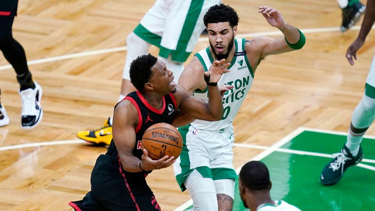 Toronto Raptors guard Kyle Lowry drives to the basket against Boston Celtics forward Jayson Tatum 
