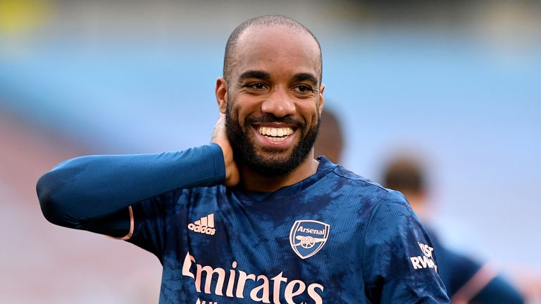 Lacazette celebrates making it 3-3 with a precise far-post header