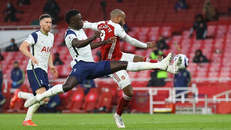 Davinson Sanchez gave away a penalty for this foul on Alexandre Lacazette