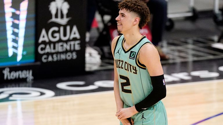 Charlotte Hornets guard LaMelo Ball holds his right wrist during (AP)