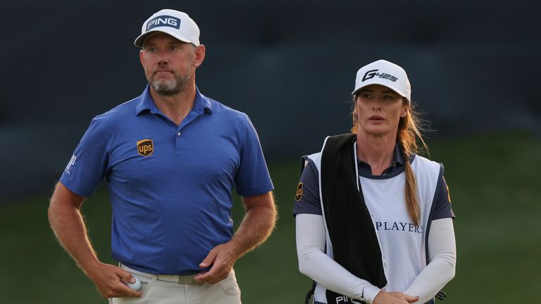 Lee Westwood of England and caddie Helen Storey look on during the third round of THE PLAYERS Championship on March 13, 2021 at TPC Sawgrass