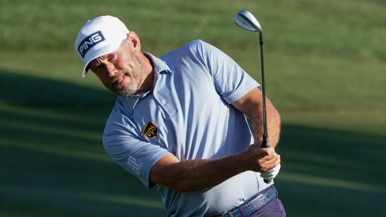 Lee Westwood, of England, chips to the green on the ninth hole during the second round of the The Players Championship golf tournament Friday, March 12, 2021, in Ponte Vedra Beach, Fla. (AP Photo/Gerald Herbert)