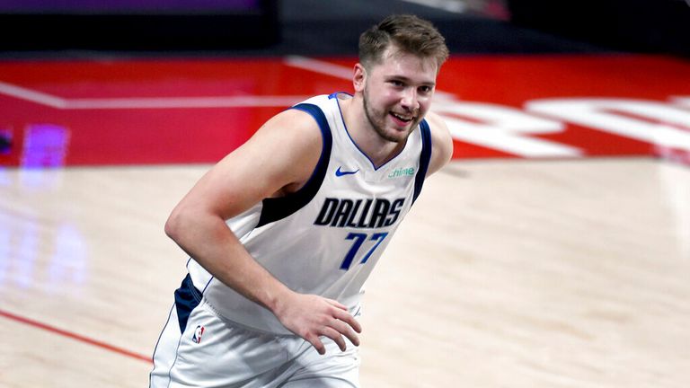 AP - Dallas Mavericks guard Luka Doncic smiles after hitting a 3-point shot during the second half 