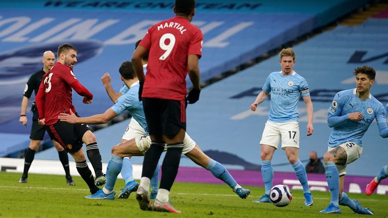 Luke Shaw steers his shot into the bottom corner to make it 2-0