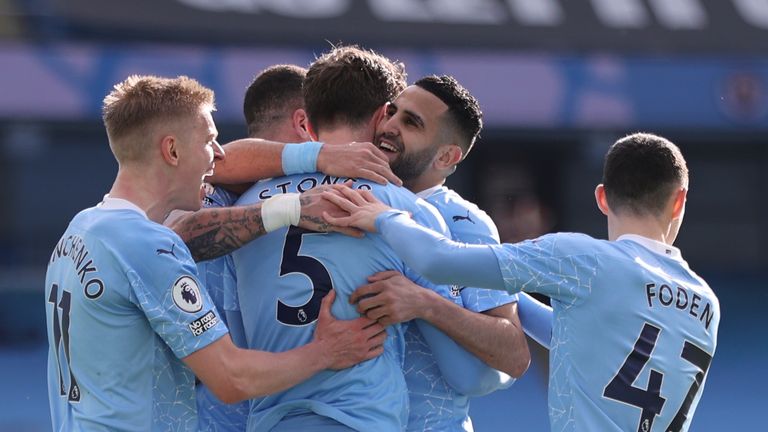 Manchester City players celebrate John Stones' winning goal against West Ham