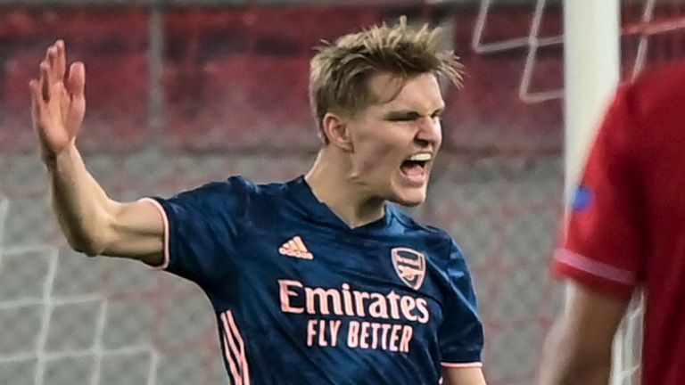 Martin Odegaard celebrates after giving Arsenal the lead against Olympiakos